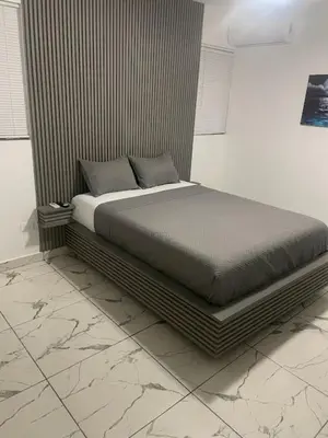 a bed sitting in a room with at LEVEL suites premium in Sosúa