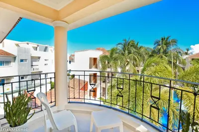 a balcony with chairs and a view of the ocean at Rosa Hermosa Penthouse | Vista Piscina • Bávaro in Punta Cana