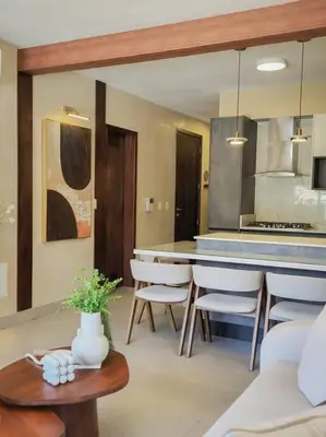 a kitchen with a table and chairs in a room at Luxury Apartment Downtown in Santiago de los Caballeros