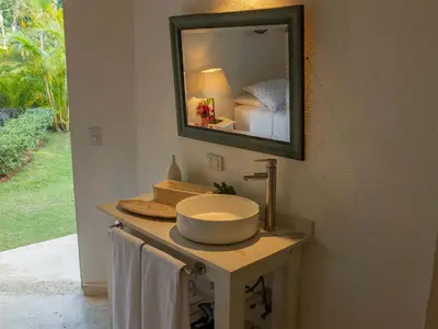 a bathroom with a sink and a mirror at JandalaVillage in Las Terrenas
