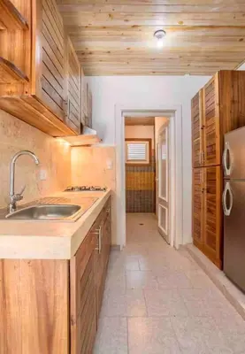 a kitchen with a sink and a refrigerator at Ballenas beach C8 in Las Terrenas