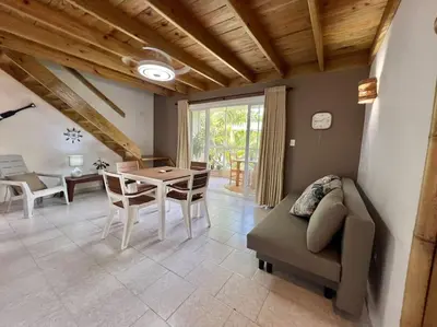 a living room with a couch and a table at Ballenas beach C8 in Las Terrenas
