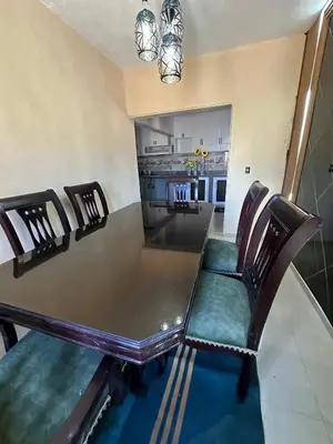 a dining room table and chairs in a kitchen at Cerca del divino niño I WiFi I TV in Constanza