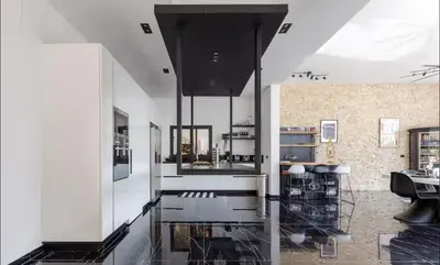 a kitchen with white walls and a glass floor at Casa black and white frente al mar in Las Galeras