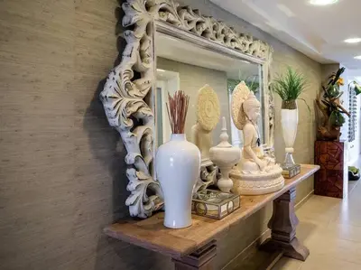 a mirror on a wall with vases on a shelf at SuiteDelux Oceanview Marbella 3BDR in Juan Pedro
