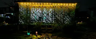 a stage with lights in a garden at night at BlueEcolandia bungalows AIRE in Jarabacoa