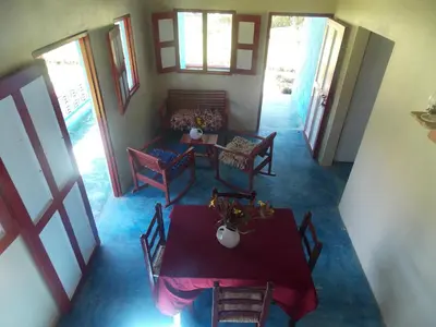 a dining room with a table and chairs at Los Bohios Campo Añil in Jarabacoa