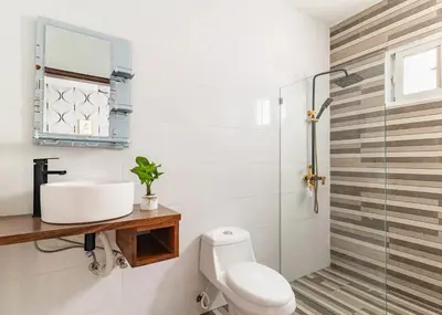 a bathroom with a sink and a toilet at Modern Vacation Paradise Villa with Private Pool in Sosúa