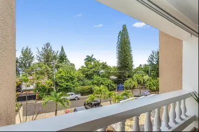 a balcony with a view of a parking lot at El Neptuno Residencial, Sosua in Sosúa