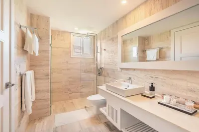 a bathroom with a toilet and a sink and a shower at Exceptional apartment nearby beach at Portillo in Las Terrenas