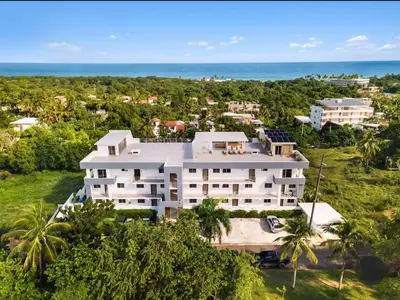 an aerial view of a building with the ocean in the background at Encuentro Studio surf kitesurf Residencia Aris in Cabarete
