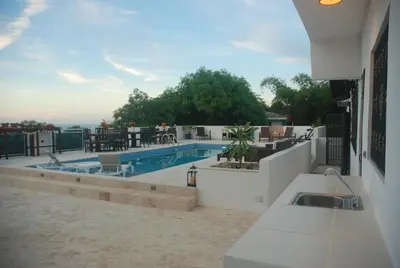 a swimming pool on the roof of a building at E&J Boutique Residences in Sosúa
