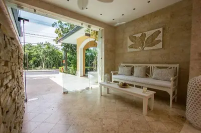 a living room with a couch and a table at Los Flamencos Aparthotel Beach Club in Bayahibe