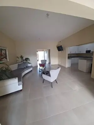 a large living room with a couch and a chair at Villa Xiomara in El Jamo