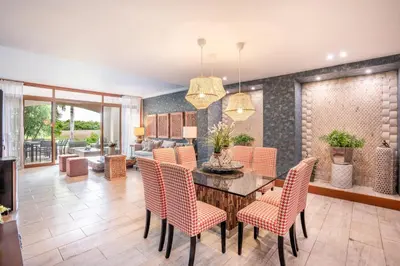 a dining room with a table and chairs at Magical apartment with garden view in Casa de Campo in El Infiernito