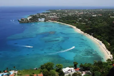 an aerial view of a beach with boats in the water at B&B El Mirador al Mar in Sosúa