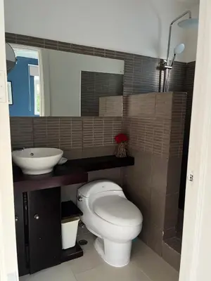 a bathroom with a toilet and a sink at bello PH cerca de la playa in Punta Cana