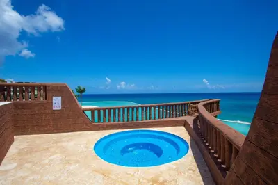 a swimming pool with a blue frisbee on a patio at Parque Acuático - Sosua! in Laguna del Higüero