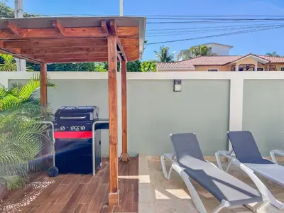 a patio with chairs and a gazebo at New 2BR APT in Sosua town, close to strip and next to supermarket in Sosúa