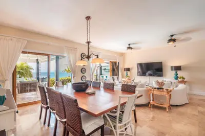 a dining room with a table and chairs at Magnificent villa with ocean view in Puerto Bahia in Sabana
