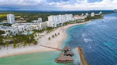 an aerial view of a beach with buildings and the ocean at Juan Dolio,Beach, Pool, 40