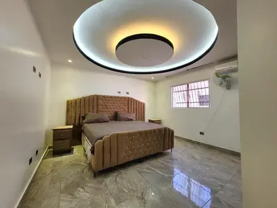 a bedroom with a bed with a large ceiling at Aparta hoteles Corales del Sur in La Viva