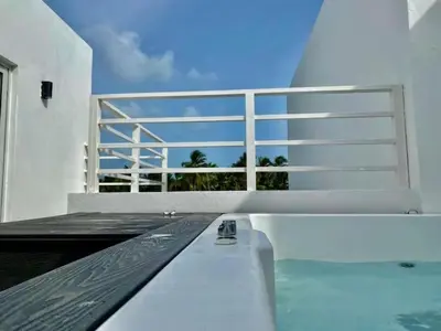 a white balcony with a bench on top of it at Estrella del caribe in La Laguna