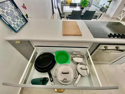 a drawer with pots and pans in a kitchen at apartamento luxury in La Laguna