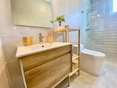 a bathroom with a sink and a toilet at apartamento luxury in La Laguna
