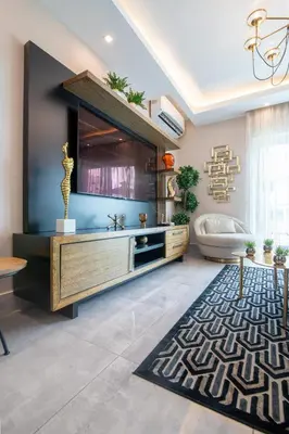 a living room with a large entertainment center at Exclusivo apartamento - Soha Suites II-B9 - 2 BR in Rincón Largo