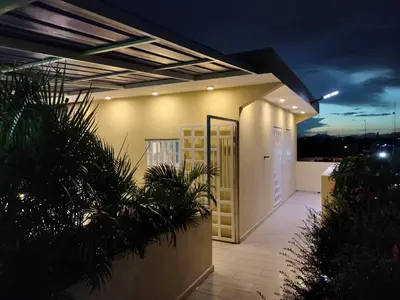 a house with a door on the side of it at Agréable appartement en rooftop in La Cabirma