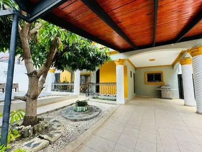 a porch of a house with a wooden ceiling at Casa completa con hermosa vista in San Felipe de Puerto Plata
