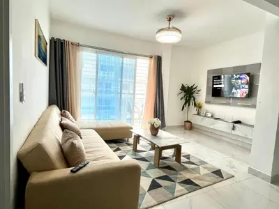 a living room with a couch and a tv at Hidden Paradise in La Grúa