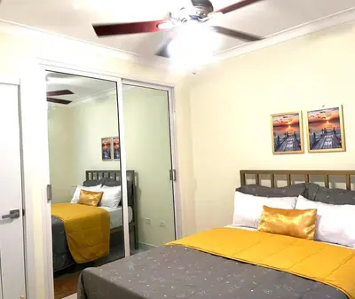 a bedroom with two beds and a ceiling fan at Hidden Paradise in La Grúa