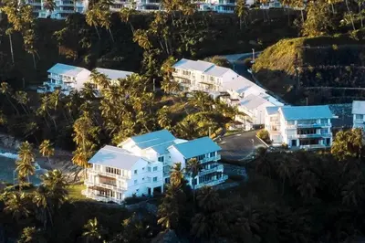 an aerial view of a resort with palm trees at Ocean Front Deluxe Condo in Punta Balandra