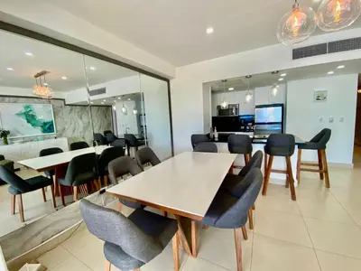 a dining room with a table and chairs at LasOlasTower JuanDolio-2Br-3Bds-7Px-WiFi-SeaView in Juan Dolio