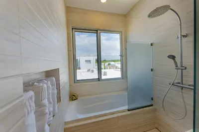 a bathroom with a tub and a window at Villa Chocolate in Laguna del Higüero