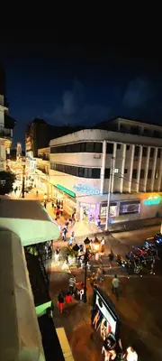 a building with a lot of people in front of it at Salomé in Sans Souci