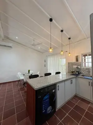 a kitchen with a dishwasher in the middle of a room at Luz de Luna Emotions in Santo Domingo