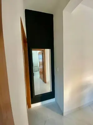 a mirror on a wall in a room at Fantástico apartamento céntrico Playa a 100 mts in Río San Juan