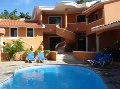 a house with a swimming pool in front of a house at Residenzia Oasis Fiordaliza in El Higo