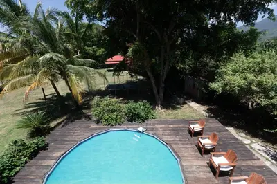 an overhead view of a swimming pool with lounge chairs at Casa Palmar in Palmar Arriba