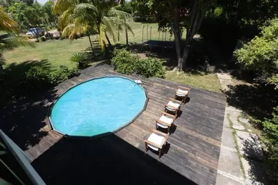a swimming pool with a deck and lounge chairs at Casa Palmar - Finca in Palmar Arriba