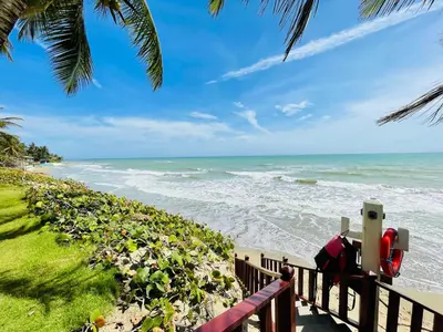a view of the ocean from a fence at Victorian Condominio in Cabarete