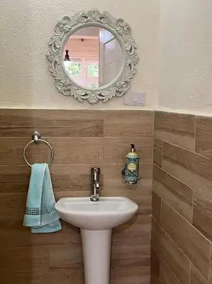 a bathroom with a sink and a mirror at Villa Reina in Buena Vista