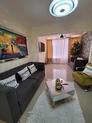 a living room with a couch and a table at Elegante apartamento en San isidro in Mendoza