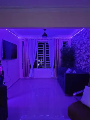 a living room with purple lighting in a living room at Elegante apartamento en San isidro in Mendoza
