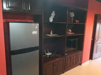 a kitchen with a refrigerator in a room at 501 Apto Entero Stunning Malecón Roof Condo in Villa Francisca