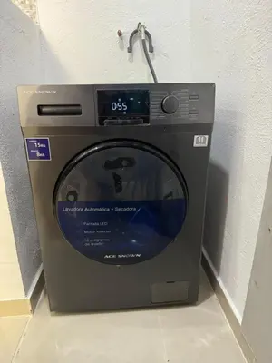 a washing machine is sitting on a floor at Casa las América in La Cana