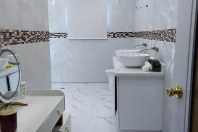 a white bathroom with a sink and a tub at Bocachica house,apts,village in Jubey